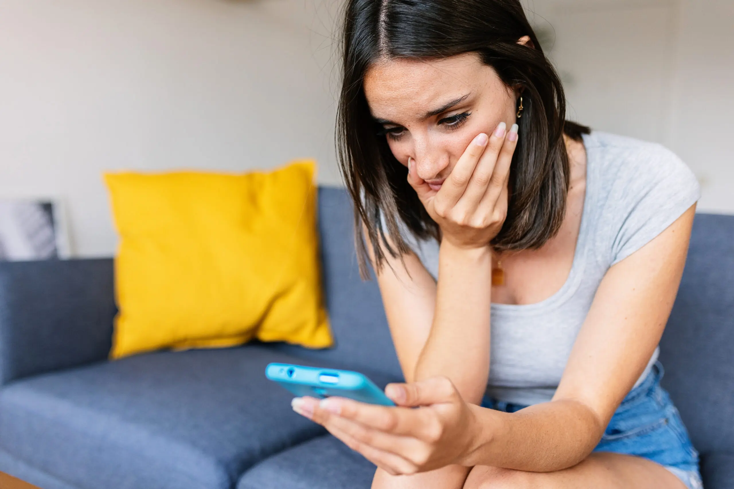 Woman at looking at her phone.